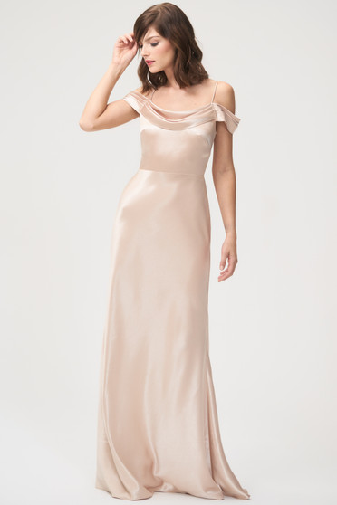 The Serena dress has a pleated cowl neck for a dramatically stunning effect with pleated and draped off-the-shoulder straps adding visual interest. The floor length bias-cut skirt creates a romantic, modern look. The dress is bodice lined with a center back zipper.