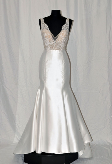 Mikado trumpet gown, scalloped V-neckline front and back, floral embroidered lace bodice with nude sweetheart lining, natural waist, chapel train.