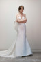 Draped V neck bodice with seamed midriff details and couture back bow.