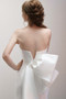 Draped V neck bodice with seamed midriff details and couture back bow.