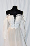 Novelty beaded bodice, with embroidered flroal details. French soft tulle skirt. Light weight construction, Detachable bow, and detachable off-shoulder balloon sleeves. Chapel train.



Available in Ivory/Ivory and Ivory /Lt. nude