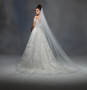 Ivory cathedral length veil with petal embroidered applique at end with cut edge.