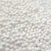 PPC DE-4 activated alumina desiccant beads. White beads are 1/8" diameter.