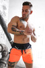 Breedwell Akira Reflective Shorts | Neon Orange | 2306-SHORTS  - Mens Fetish Shorts - Front View - Topdrawers Clothing for Men
