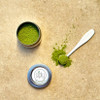 Ceremonial Matcha spilled on counter with spoon