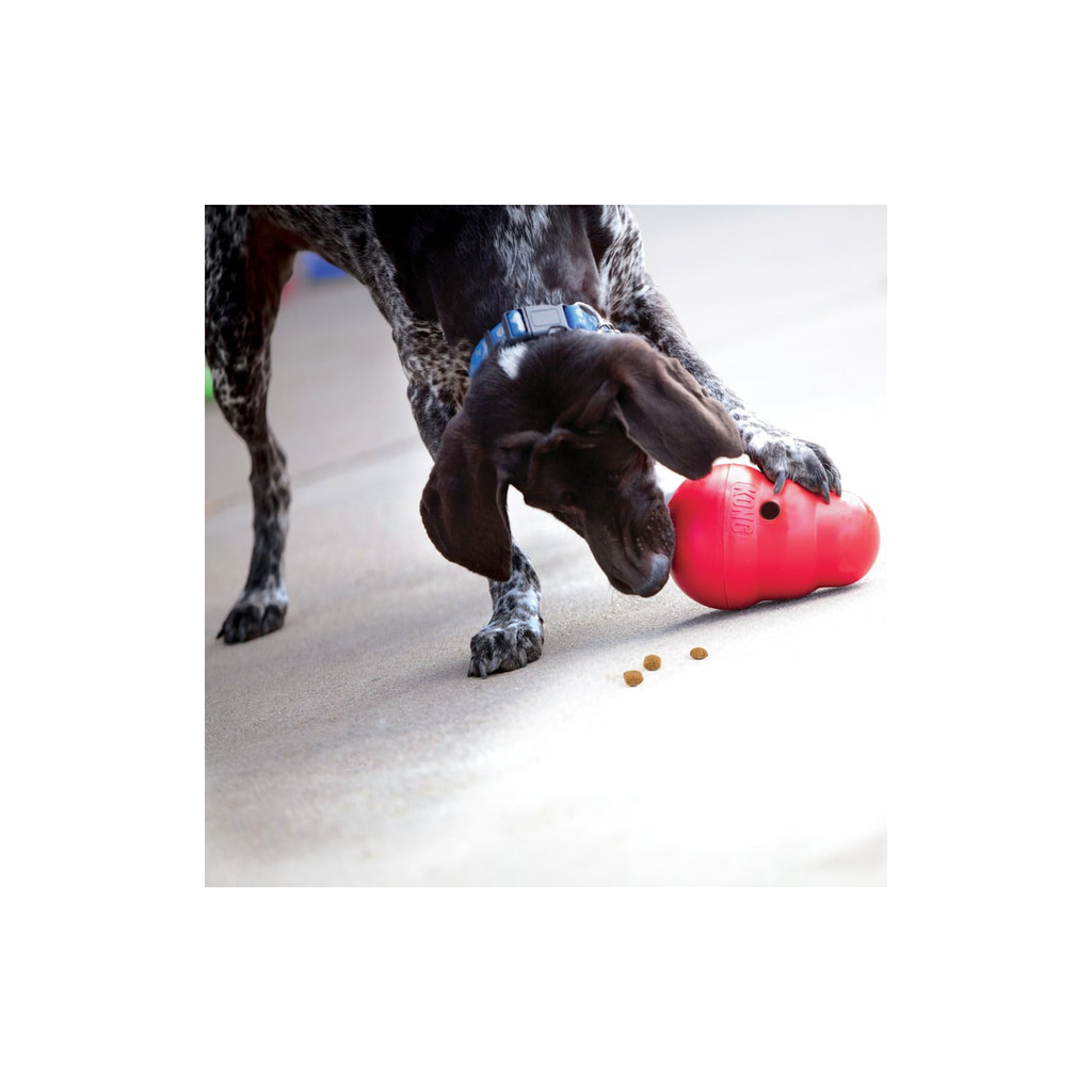 Large KONG Wobbler treat dispensing dog toy in red, designed for engaging pet play.
