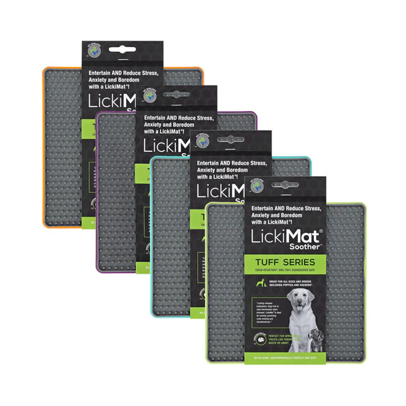 LickiMat TUFF Soother in various colors, designed for slow feeding and reducing anxiety in dogs.