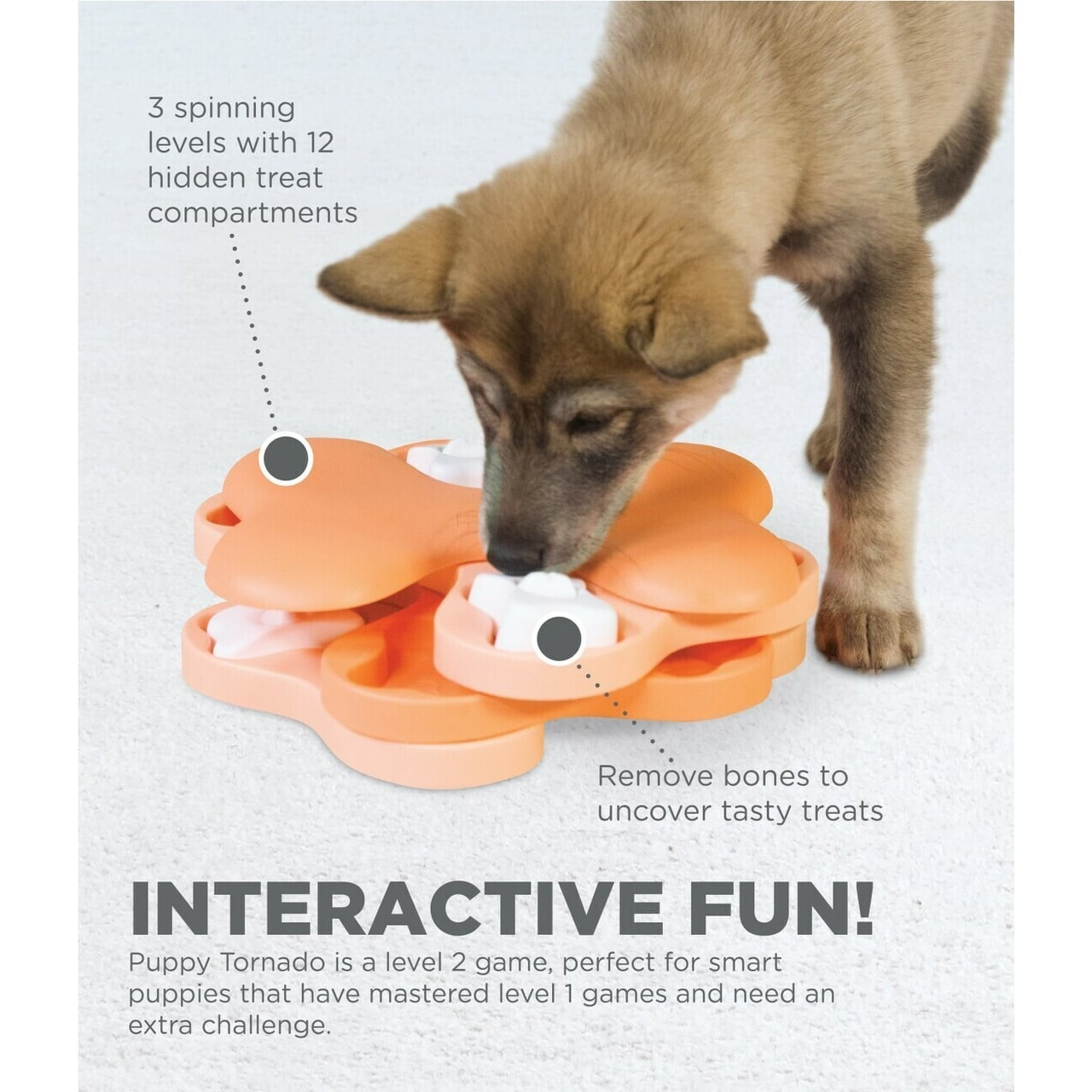 Nina Ottosson Tornado dog toy in bright orange, featuring spinning levels for puppy treat puzzles.