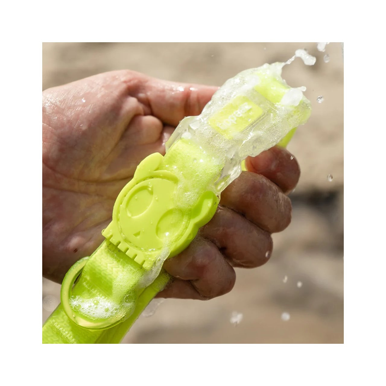 Zee.Dog Neopro Lime Collar being washed, showcasing vibrant lime color and unique design.