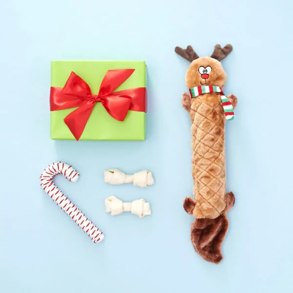 Zippy Paws Holiday Jigglerz Reindeer toy with festive gift and candy cane.