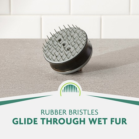 FURminator Bathing Brush with rubber bristles for cats and dogs, gliding through wet fur.