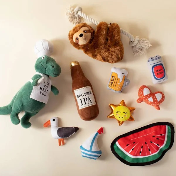 Fringe Studio BBQ Rex Chef Plush Squeaker Dog Toy featuring a dinosaur in a chef hat.