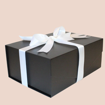 Black gift box finished with white ribbon