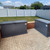 Razorback Bear-resistant Metal Trash Can Storage Enclosure on a patio