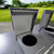 Both lids open on Razorback Metal Dual Trash Can Storage Enclosure