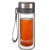 Enjoy loose tea on the go with our new portable tea tumbler. It sports a stainless steel infuser, tough borosilicate glass inside and out, a flexible strap for ease of transport and double-wall construction to maintain temperature. Holds 10 delicious ounces.
This double-wall glass travel tumbler is fitted with a cap that fits both the glass container and the plastic infuser, allowing one to stop the infusion and prevent tea from growing bitter.
