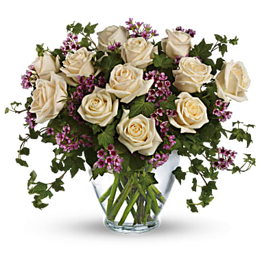 Send an English garden someone's way with this gorgeous arrangement. Tendrils of green ivy trail delicately from a beautiful bunch of cream-colored and lavender roses with lavender wax flower for a bouquet that's both traditional and unexpected.