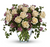 Send an English garden someone's way with this gorgeous arrangement. Tendrils of green ivy trail delicately from a beautiful bunch of cream-colored and lavender roses with lavender wax flower for a bouquet that's both traditional and unexpected.