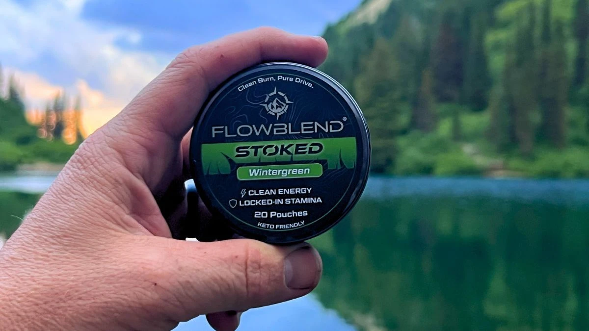 STOKED Wintergreen can against a mountain