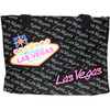 Canvas Totebag that is black, has Las Vegas in tiny gray print all over it with an overlay large Pink Las Vegas font and finally a Large Welcome to Las Vegas Sign in toward one side.