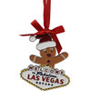 Metal Las Vegas Gingerbread Man Shape ornament that also has the Las Vegas Welcome Sign; with a Red Ribbon.