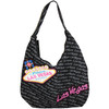 Super Handbag style LV purse that is black, has Las Vegas in tiny gray print all over it with an overlay large Pink Las Vegas font and finally a Large Welcome to Las Vegas Sign in toward one side.