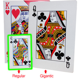 King of hearts and Queen of Clubs shown on the box of these Gigantic playing cards in in comparison next to a deck of regular playing cards. 