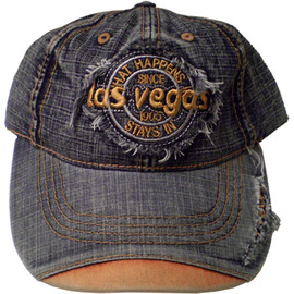 Denim Baseball style cap with Las Vegas on the front. The bill has a pop of rust color on it.