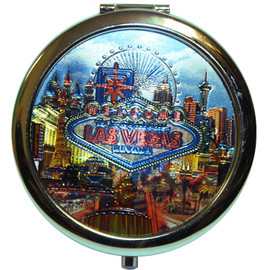 Shiny metallic design of popular Las Vegas casinos in a Neon feel on this round compact mirror.