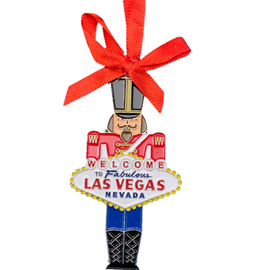 Metal Las Vegas Soldier Shape ornament that also has the Las Vegas Welcome Sign; with a Red Ribbon.