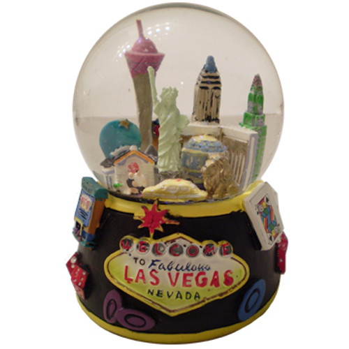 Acrylic base and a Glass Snowglobe. Base is Black with colorful icons. Inside the snowglobe has glitter snow and colorful 3D versions of the Las Vegas Casinos that you know and love.