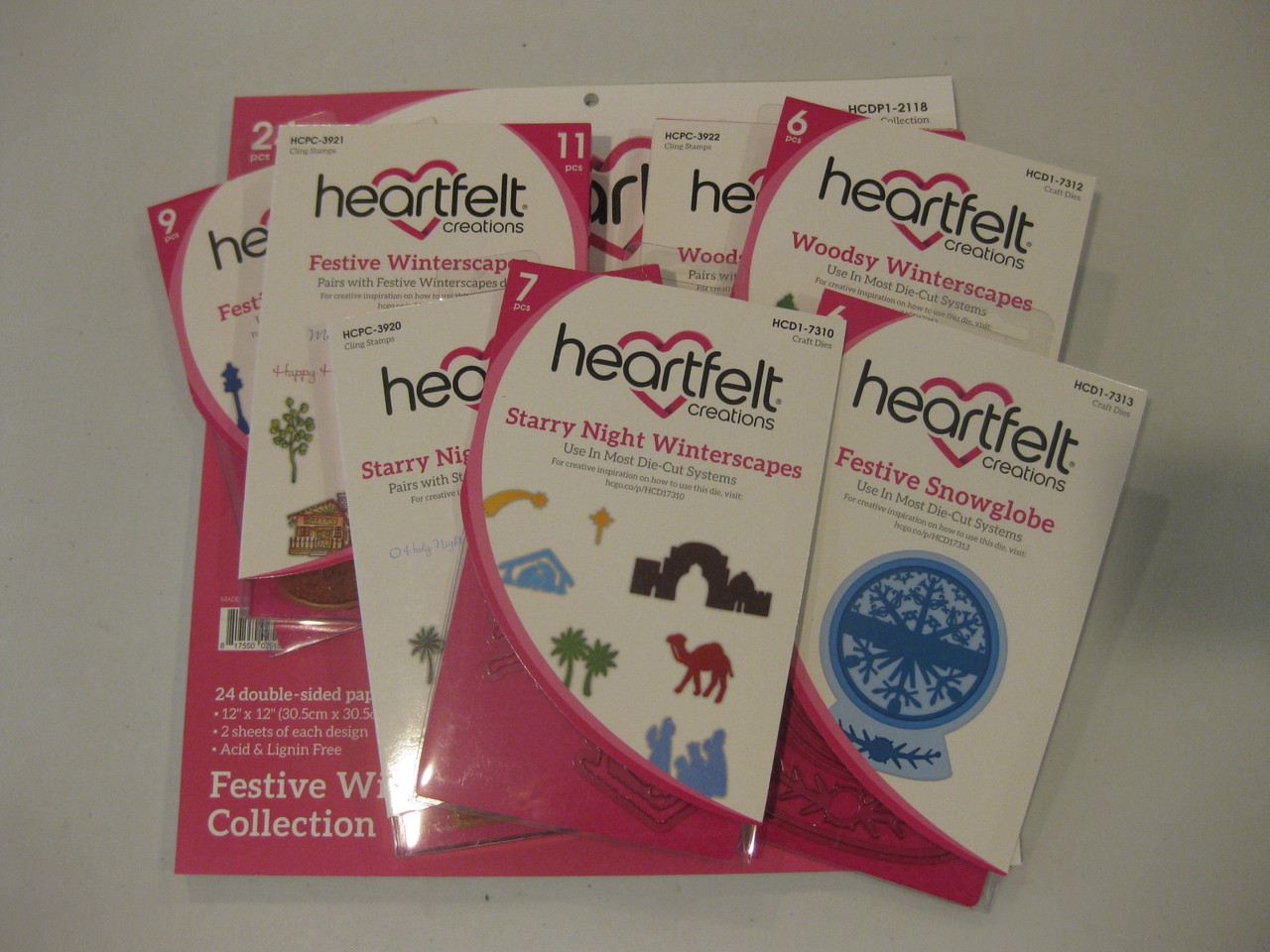 Heartfelt Creations Festive Winterscapes Collection- 1 paper pad, 4 dies, and 3 stamps (No pink bag)