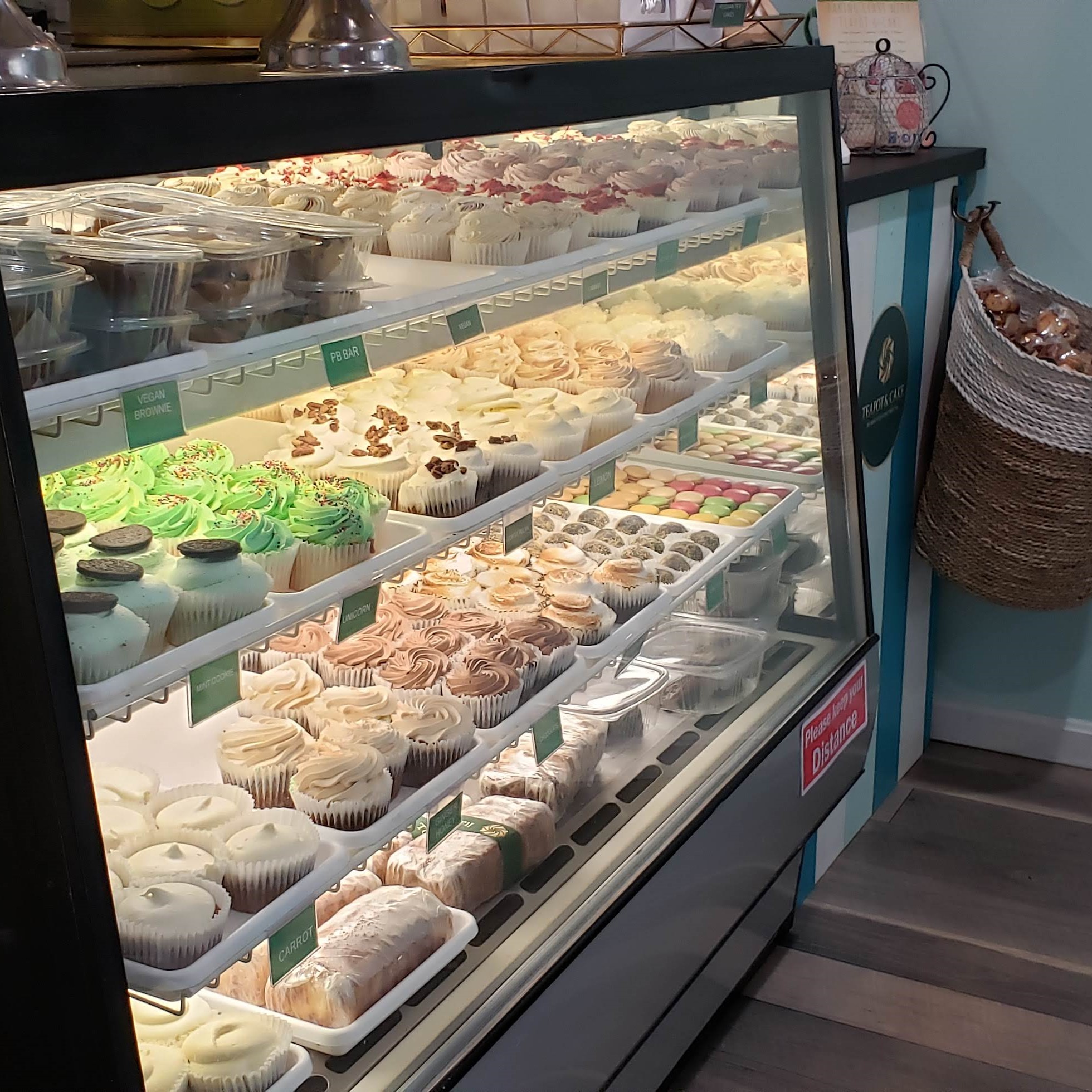 Bakery display case with cupcakes and pastries 