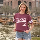 Texas A&M Aggies maroon jersey style shirt with white sleeve stripes and number 12 graphic