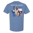 Light blue Texas A&M T-shirt featuring "Texas A&M University" on the front and a large back graphic of Reveille in front of a distressed American flag with the Texas A&M logo.