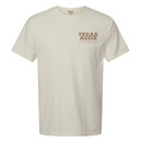 "TEXAS AGGIE" centered on the left chest in brown ink with "OUTDOORS" printed below in rope font.