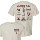 Front and back designs of the Aggie Faith Collage short sleeve t-shirt in parchment. Front and back designs of the Aggie Faith Collage short sleeve t-shirt in parchment.