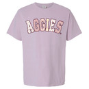 Light purple Texas A&M Aggies t shirt with patchwork “Aggies” lettering featuring floral and gingham patterns across the front