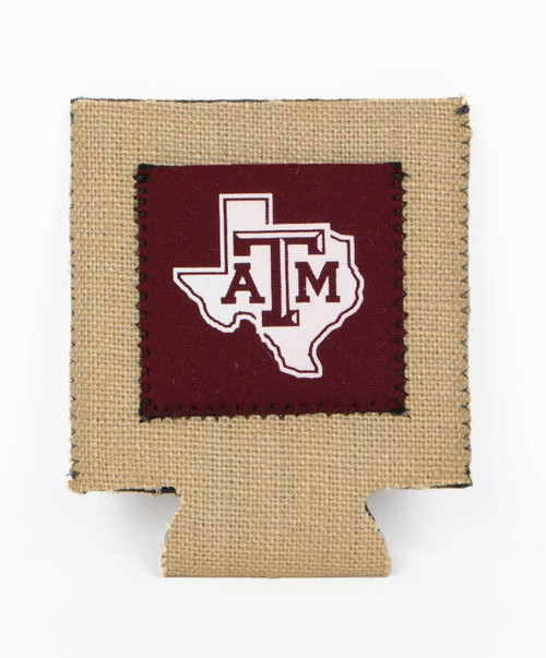Texas A&M Aggies koozie with maroon patch ATM logo over Texas outline on textured neutral background