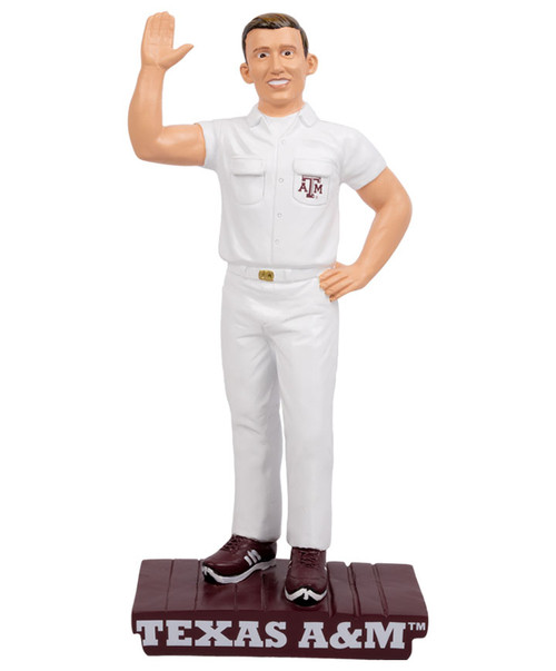 Texas A&M Aggies yell leader desk statue with figure in uniform standing on Texas A&M base