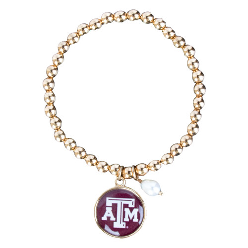 Texas A&M gold-tone beaded bracelet featuring a round maroon enamel charm with the Texas A&M logo. Stylish jewelry accessory perfect for game days, everyday wear, and Aggie fans.