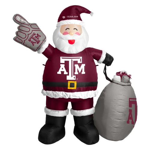 7-foot Texas A&M inflatable Santa wearing maroon Aggie attire with a Texas A&M logo, holding a foam finger and standing beside a gift sack with the Texas A&M logo. Outdoor holiday decoration for yards and Christmas displays.