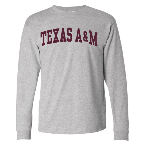 Heather gray Texas A&M long sleeve T-shirt featuring classic maroon arched "Texas A&M" lettering across the chest. Comfortable long sleeve tee for game days, campus, tailgates, and everyday wear.