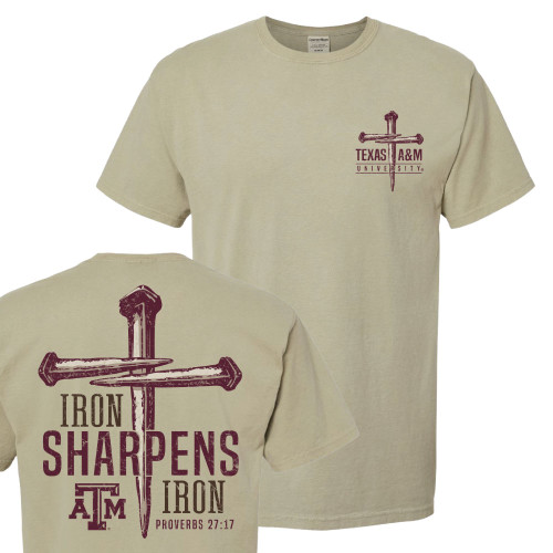 Sand-colored Texas A&M T-shirt featuring a small left chest crossed nails graphic with "Texas A&M University" and a large back design with crossed nails, "Iron Sharpens Iron," and the Texas A&M logo.