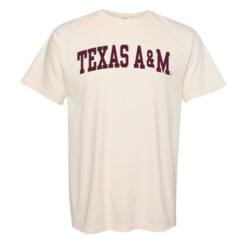 Cream Texas A&M T-shirt featuring bold arched maroon "Texas A&M" lettering across the chest. Classic short sleeve tee for game days, campus, and everyday wear.
