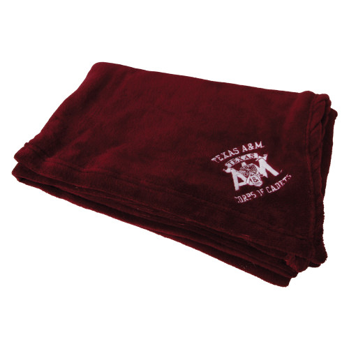 Maroon Texas A&M Corps of Cadets fleece blanket featuring an embroidered Corps of Cadets logo in one corner. Soft blanket for game days, home décor, lounging, and everyday comfort.