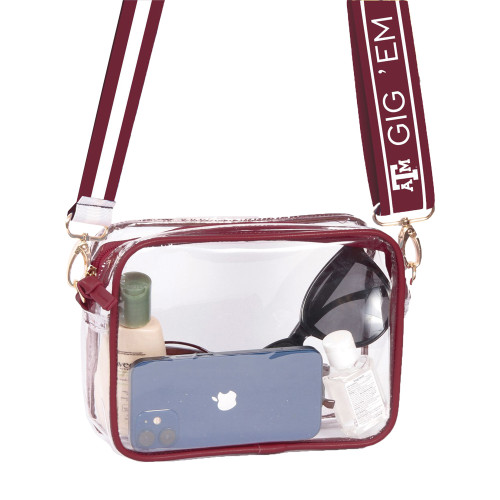 Texas A&M clear crossbody bag featuring maroon trim, an adjustable "Gig 'Em" logo shoulder strap, zippered closure, and stadium-approved design for game days and events.