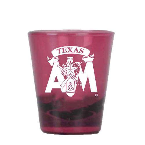 Translucent maroon Texas A&M Corps of Cadets shot glass featuring a white Corps emblem with a "Texas" banner graphic. Collectible drinkware for Aggie and Corps supporters.