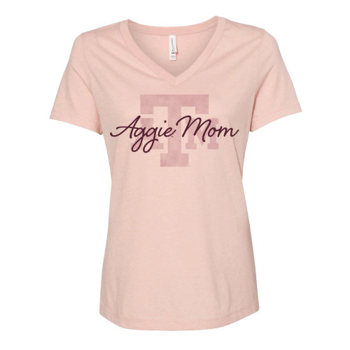 Peach colored v-neck t-shirt that has a slightly darker ATM printed in the center with a maroon script "Aggie Mom" printed overtop.
