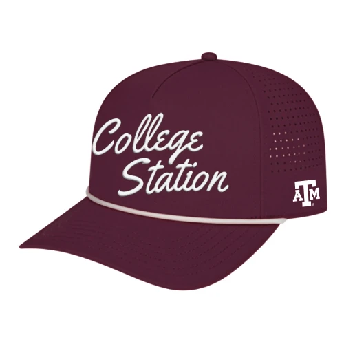 Maroon Texas A&M College Station cap with white script lettering on front, perforated side panels, curved bill, and small ATM logo on side